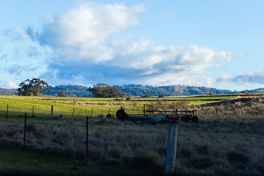 old rusted farm machinery in paddock