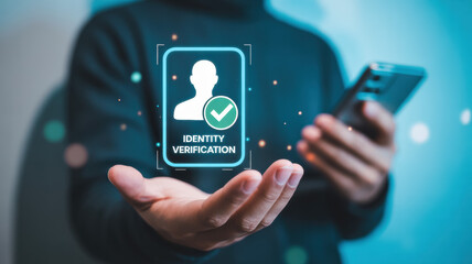 User holding a smartphone and displaying a glowing identity verification graphic against a blue tech