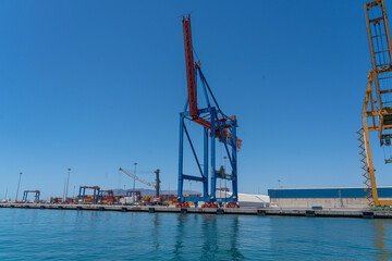 Port scene with cranes and clear blue sky.. M&aacute;laga, Spain