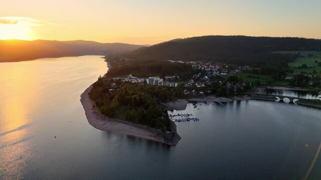 Aerial drone footage of flight over the Schluchsee in the Black Forest in Southern Germany during scenic sunset