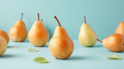 Artistic composition featuring pears arranged in a geometric pattern on a minimalistic background.
