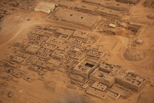 Aerial view of ancient ruins scattered across the arid landscape, revealing the remnants of a once-thriving civilization, Cairo, Egypt.