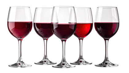 Five wine glasses, filled with various shades of a red liquid, isolated on black