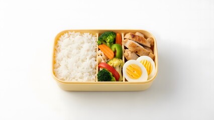Delicious and healthy bento box lunch with rice, chicken, vegetables, and eggs