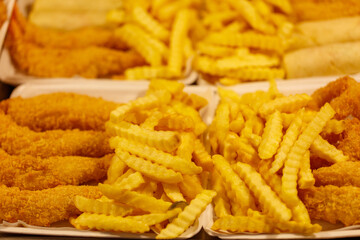 A plate of fried chicken and french fries