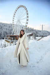 Girl in a white fur coat, winter portrait with snowy background, cozy and stylish cold season fashion look.