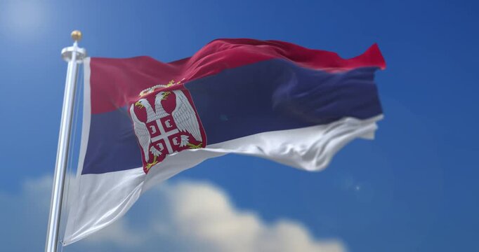 Serbia National Flag Waving in Daylight Honoring Statehood Day 15 February 1804