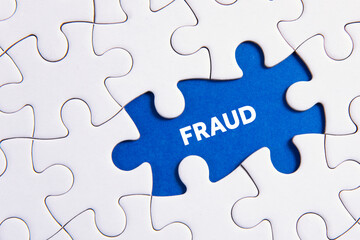 Fototapeta premium business concept puzzle with word fraud 
