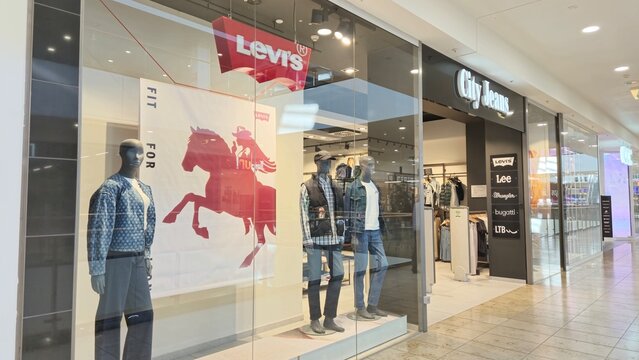 Vilnius Lithuania - 03.29.2025 City Jeans store with Levi&rsquo;s promotional banner and male mannequins in denim outfits in the window display, offering popular jeanswear brands inside