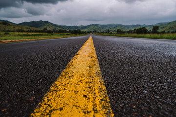 Long Empty Road with Emotional Perspective of Isolation and Nature