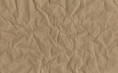 Fototapeta premium A blank sheet of crumpled brown paper texture with a rough wrinkled surface and aged vintage grunge pattern creates a creased antique cardboard backdrop design for an empty textured material page