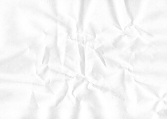 A blank sheet of white crumpled paper provides a rough textured background with a creased and...
