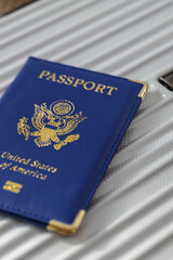 United States passport  and modern suitcase, travel preparation still life with luggage and international journey concept