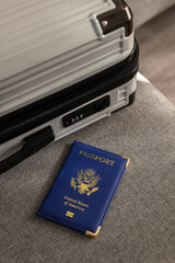 United States passport  and modern suitcase, travel preparation still life with luggage and international journey concept