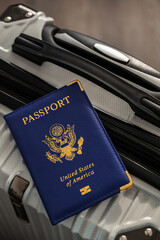 United States passport  and modern suitcase, travel preparation still life with luggage and international journey concept