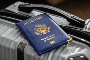 United States passport  and modern suitcase, travel preparation still life with luggage and international journey concept