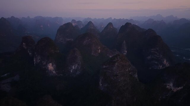Sunrise aerial view of karst landscape near Xianggong Mountain, Yangshuo, Guilin, China