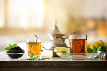 Glasses with green tea with mint with room in background