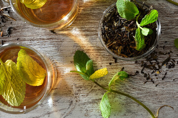Detail of freshly brewed green teas with mint top view