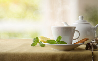 Green tea on a table with tablecloth in living room