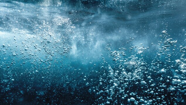 Bubbles rise in deep blue water, creating an abstract underwater texture