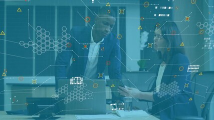 Business professionals discussing over digital data processing animation in office - Powered by Adobe