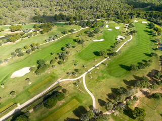 Aerial view, Spain, Balearic Islands, Mallorca, Capdepera, Cuevas de Arta and Platja de Canyamel with golf course, sand bunker, green, golfer