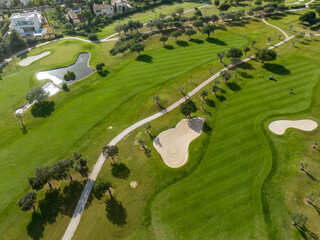 Aerial view, Spain, Balearic Islands, Mallorca, Capdepera, Cuevas de Arta and Platja de Canyamel with golf course, sand bunker, green, golfer