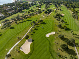 Aerial view, Spain, Balearic Islands, Mallorca, Capdepera, Cuevas de Arta and Platja de Canyamel with golf course, sand bunker, green, golfer