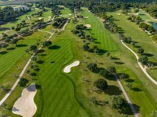 Aerial view, Spain, Balearic Islands, Mallorca, Capdepera, Cuevas de Arta and Platja de Canyamel with golf course, sand bunker, green, golfer
