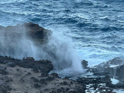 Powerful Ocean Waves Crashing Against Black Lava Rocks in Hawaii