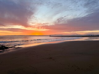 Pink Sunrise Over Roker Beach in Sunderland, England