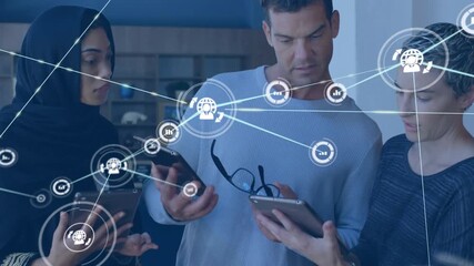 Animation of network of digital icons against diverse colleagues discussing together at office - Powered by Adobe