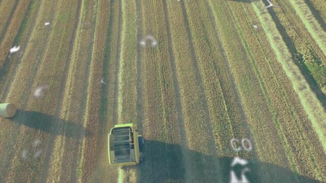 Harvesting machine working in field with agricultural technology animation overlaid