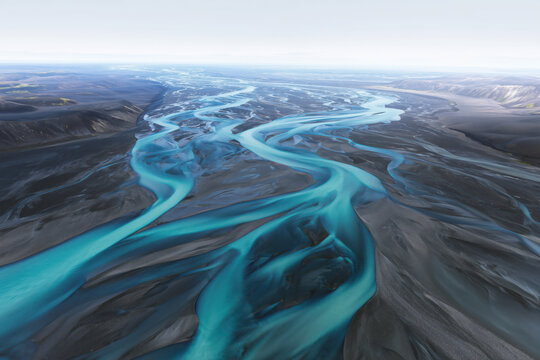 Aerial view of a river flowing through the landscape on the site of a melted glacier