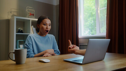 Woman see middle finger remote, obscene hand fuck you gesture from laptop screen. Person visit...