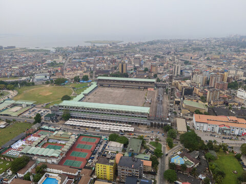 Aerial view of the Tafawa Balewa Square surrounded by buildings and greenery under a hazy sky, Lagos, Nigeria.