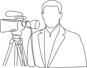 Man in suit holding video camera on tripod stand