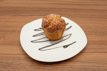 ndividual muffins, highlighting the uniformity or variation in the size and color of the golden crust, as well as the adherence of the paper liners to the batter