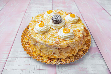 This image highlights a chocolate tiramisu-style cake, where layers of soaked cocoa sponge...