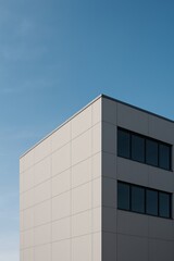 Obraz premium Modern minimalist architecture under sky.