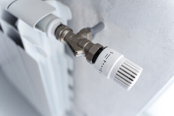 Radiator heating, concepts of heat and energy conservation and the importance of rational use of resources in the cold season. Turning on and off the heating.