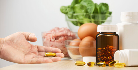 Nutritious food supplements with eggs, fresh vegetables, and meat provide essential protein,...