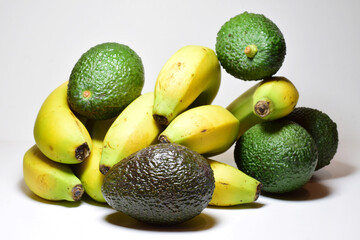 Close up, avocado and banana, tropical fruits, in front shot and white background.	