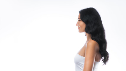 Profile Portrait of Smiling Woman With Long Hair and Glowing Skin in Studio © Buyanskyy Production