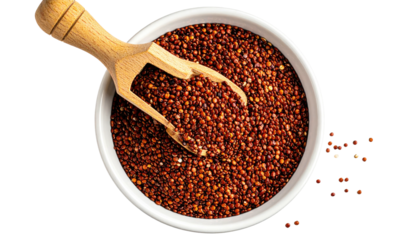 Overhead shot of red quinoa in a white bowl with a wooden scoop, all on a dark background