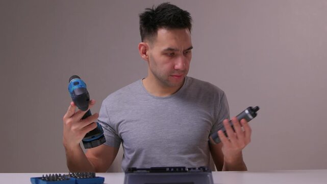 Closeup of hand choosing screwdriver pieces for detailed maintenance, Detailed scene of hand carefully selecting screwdriver bits for fine electronic or furniture repair