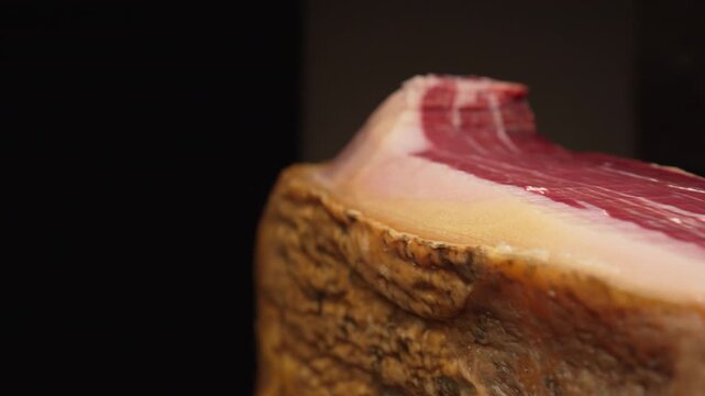 Lateral Pan of Iberian Ham Texture in Dramatic Lighting, 4K Slow Motion