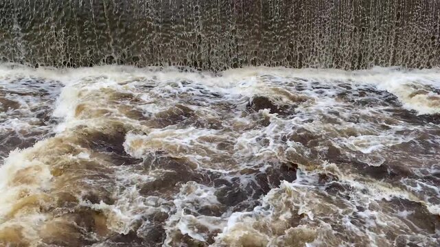 Heavy water flow into and through a fish pass after a heavy rain storm