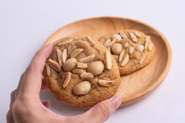 soft cookies with almond macadamia and chocolate on a table and plate